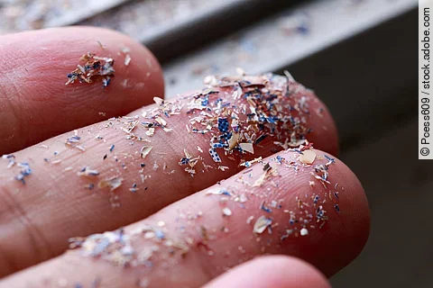 Close up side shot of microplastics lay on people hand.Concept o
