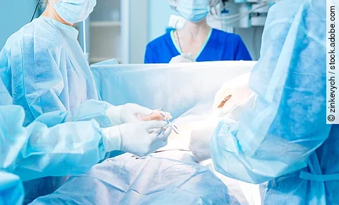 Serious doctor looking at her assistant