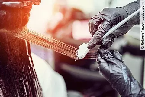 .Woman gets new hair color at the salon