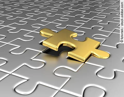 goldenes Puzzleteil