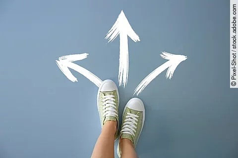 Woman standing on color background with arrows pointing in diffe