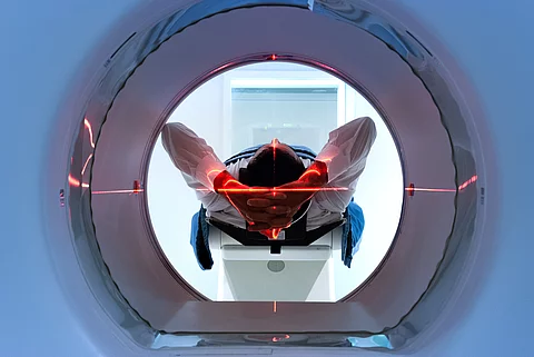 patient entering an MRI machine to produce a detailed and intern