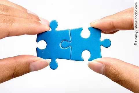 holding jigsaw puzzle