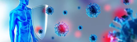 Illustration eines blauen menschlichen Körpers mit einem transparenten Schild, der mehrere schwebende, blau und rot gefärbte Viruspartikel abwehrt.