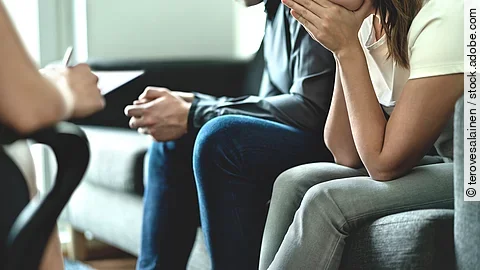 Hopeless and upset couple in therapy. Counseling or meeting with