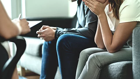 Hopeless and upset couple in therapy. Counseling or meeting with