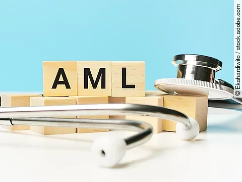 Phrase AML written on wooden cubes with stethoscope. Medical and