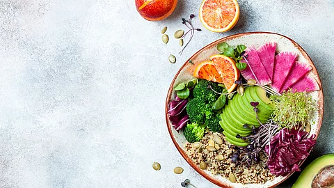 Vegan, detox Buddha bowl with quinoa, micro greens, avocado, blo
