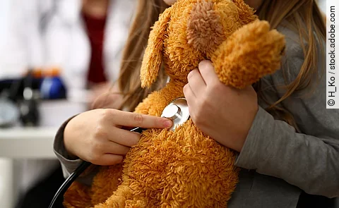 Female hand of little girl hold stethoscope listen heart bit concept closeup