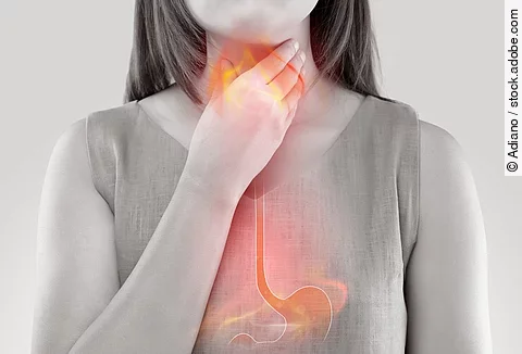 Woman Suffering From Acid Reflux Or Heartburn-Isolated On White 